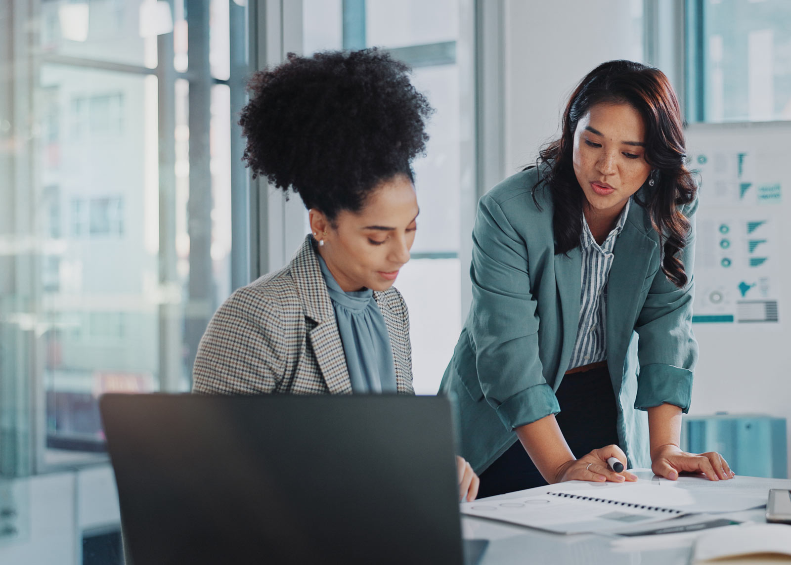 two female executives collaborating